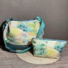 sac seau bucket oasis corail et pétrole avec bandoulière face portefeuille