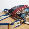 sac anesa birman détails dessus petit format fermé par rabat avec poches intérieures.